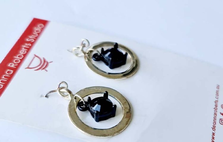 Ding Ding Silver and black stone earrings 3.5cm x 2cm flat silver ring with cut black stone hanging in centre destash.au